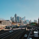vehicles on road near buildings during daytime