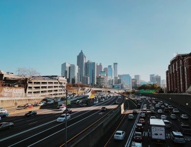 vehicles on road near buildings during daytime