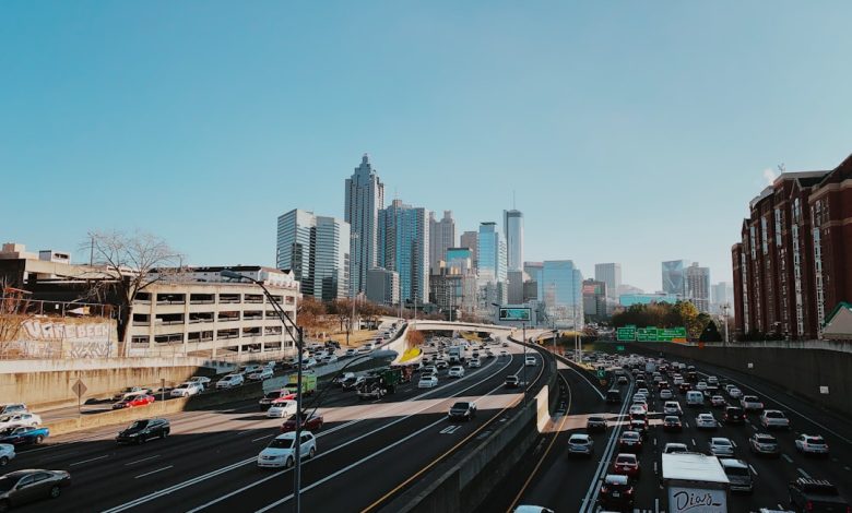 vehicles on road near buildings during daytime