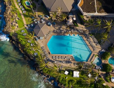 Beautiful aerial view of the pool area at Turtle Bay Resort in Kahuku, Hawaii, showcasing lush surroundings.