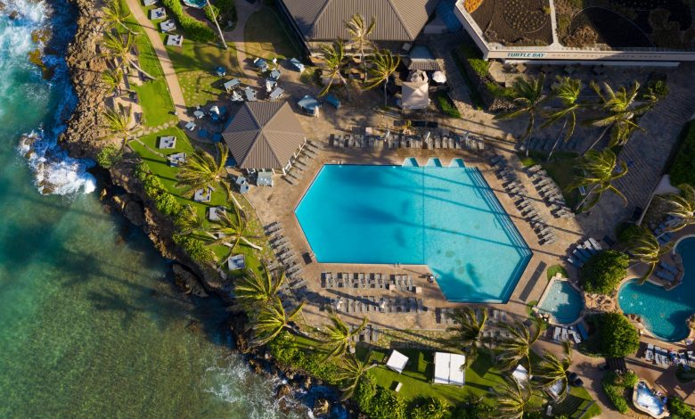 Beautiful aerial view of the pool area at Turtle Bay Resort in Kahuku, Hawaii, showcasing lush surroundings.