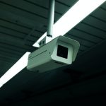 Close-up of an indoor ceiling-mounted security camera for surveillance applications.