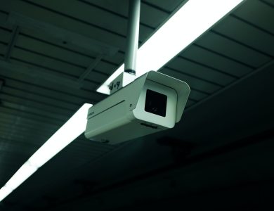 Close-up of an indoor ceiling-mounted security camera for surveillance applications.