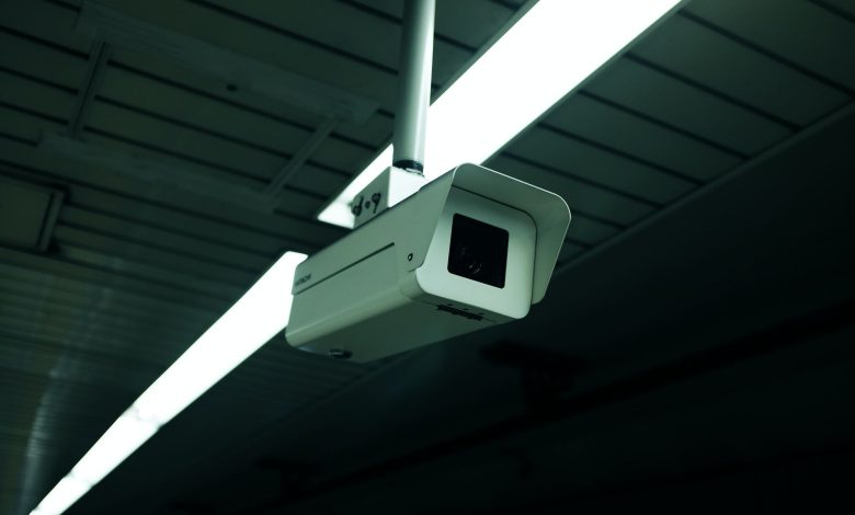 Close-up of an indoor ceiling-mounted security camera for surveillance applications.