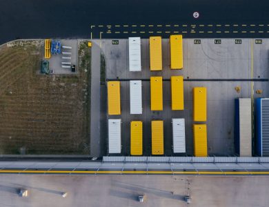 Aerial shot of colorful cargo containers at a warehouse in Poznań, Poland.