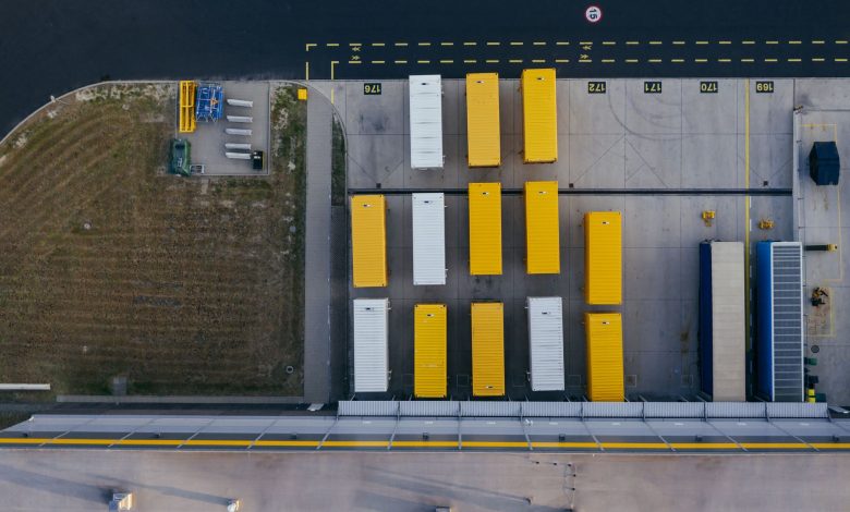 Aerial shot of colorful cargo containers at a warehouse in Poznań, Poland.