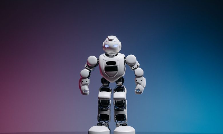 A modern toy robot standing on a gradient background, showcasing innovation and technology.