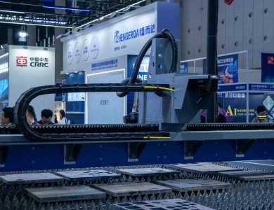 A view of advanced industrial machinery displayed at a trade fair exhibit.