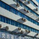 Exterior of urban building with air conditioners on the facade in Luoyang, China.