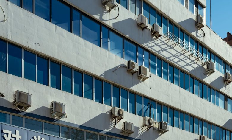 Exterior of urban building with air conditioners on the facade in Luoyang, China.