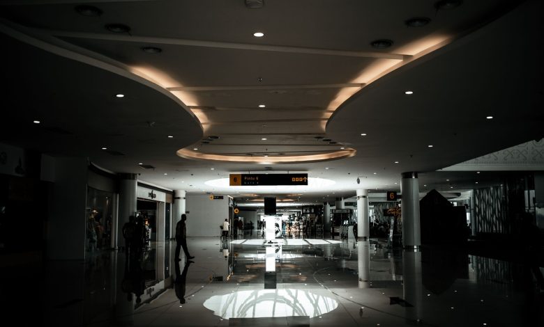 Sophisticated lobby with modern design and ambient lighting, featuring a spacious hallway.