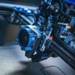 Detailed view of a high-tech 3D printer mechanism showcasing precision engineering.