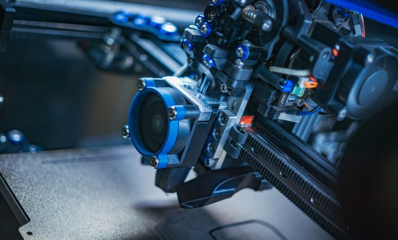 Detailed view of a high-tech 3D printer mechanism showcasing precision engineering.