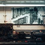 A well-organized workshop scene featuring tools and machinery on a workbench.