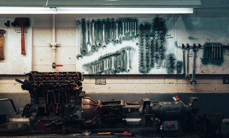 A well-organized workshop scene featuring tools and machinery on a workbench.