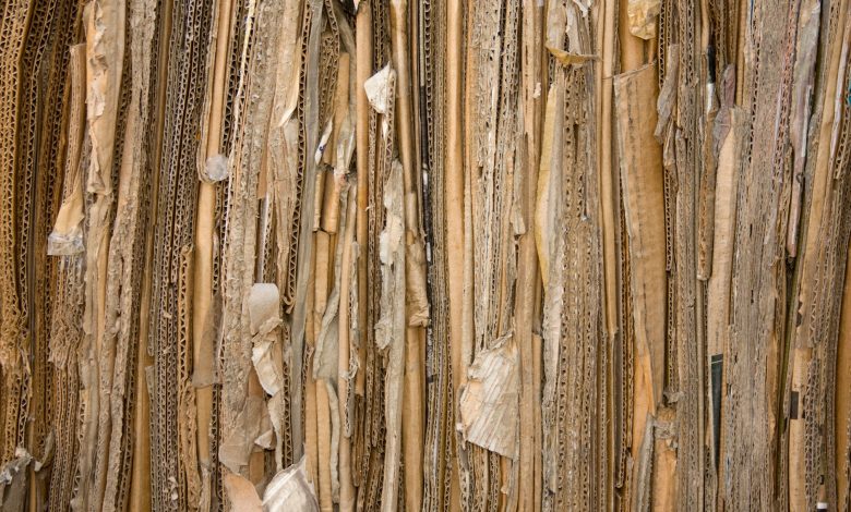 Detailed view of stacked recyclable cardboard showing texture and patterns.